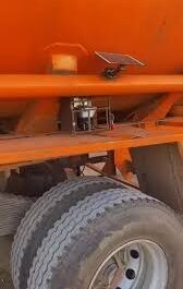 Men react after spotting CCTV camera and solar panel installed on fuel tanker to monitor driver